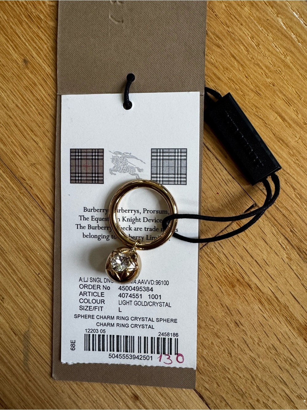Burberry Gold Tone Oval Charm Ring with Cord Detail